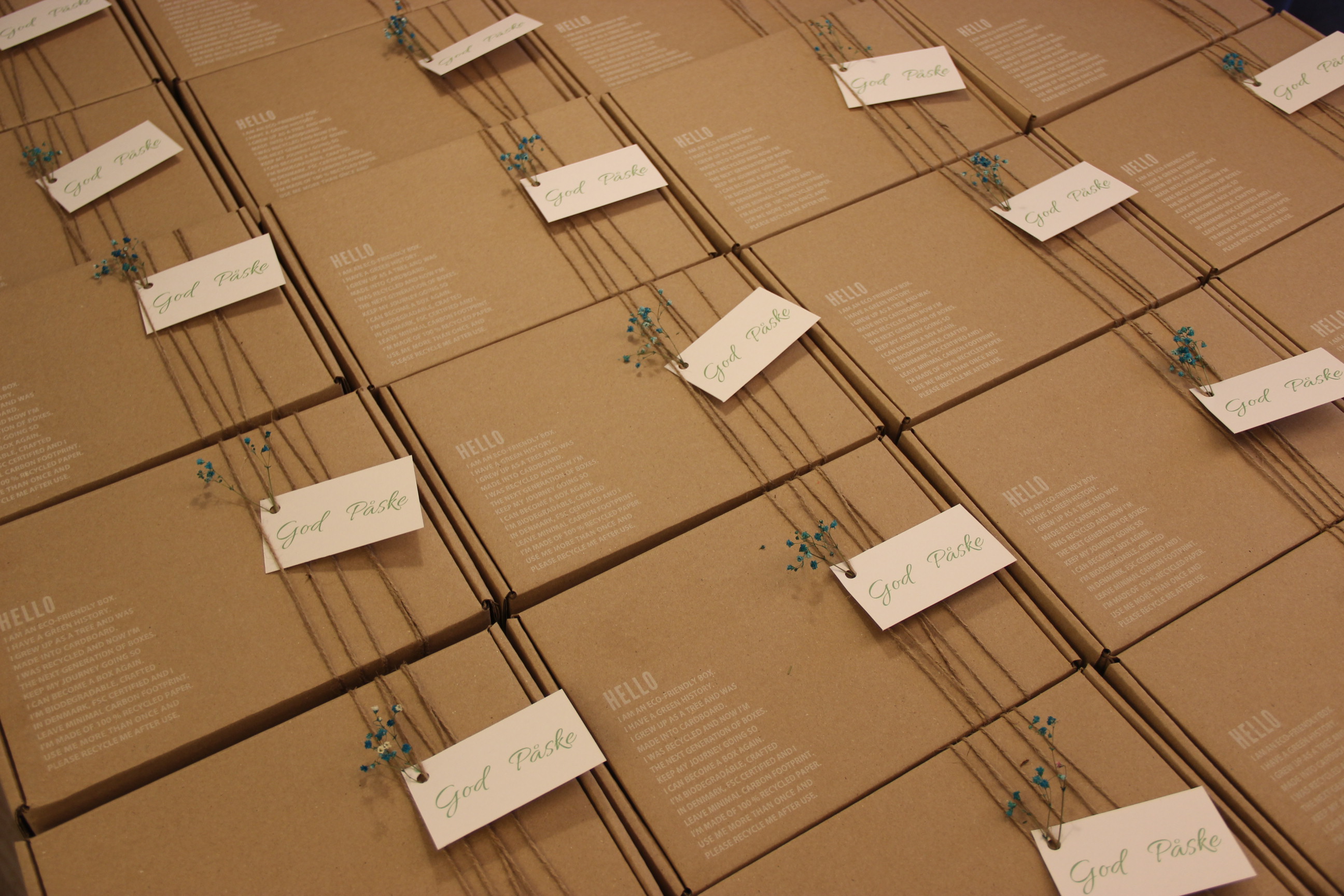 Rows of personalised recyclable gift boxes prepared for a seasonal corporate order.